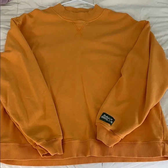 Daily Drills women’s Tajin Orange Crewneck Sweater